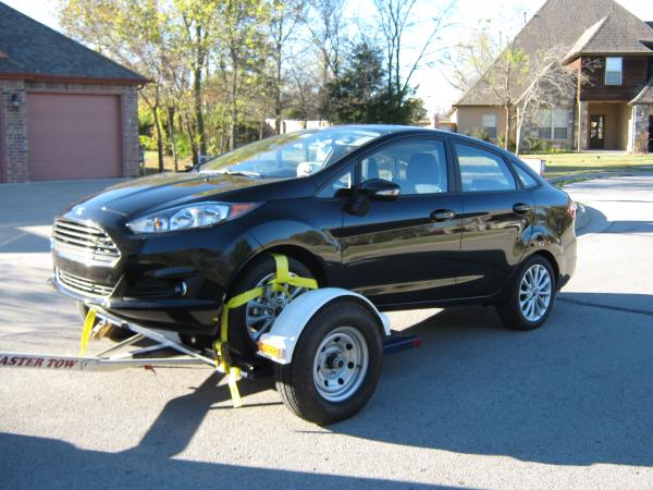 We found out we can FLAT TOW this Ford Fiesta even tho it's a Automatic, just unhook the Neg. cable from battery and put it in Neutral!