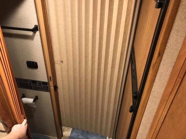 With the Jayco panel in use, there was no way to slide around the bathroom door after showering to finish drying and changing in the back half of the 